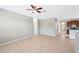 Large living room with tile floors and a ceiling fan at 20209 Merry Oak Ave, Tampa, FL 33647