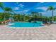 Community pool featuring a waterpark area with a splash pad, bridge, and several palm trees at 20209 Merry Oak Ave, Tampa, FL 33647