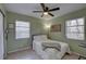 Cozy bedroom featuring neutral walls, ample natural light, and a contemporary ceiling fan at 2311 Wellesley, Bradenton, FL 34207