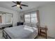 Bright bedroom featuring neutral walls, ample natural light, and a contemporary ceiling fan at 2311 Wellesley, Bradenton, FL 34207