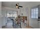 Dining area with table, chairs and shelving, adjacent to the screened-in lanai, perfect for relaxation at 2311 Wellesley, Bradenton, FL 34207