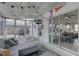 Enclosed sunroom featuring ample seating, tiled floor, and access to the backyard at 2311 Wellesley, Bradenton, FL 34207
