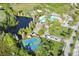Aerial view showcasing community amenities, including pool, clubhouse, tennis, and basketball courts at 4110 Huntingdale Ct, Wesley Chapel, FL 33543
