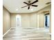 Upstairs bonus room features wood look floors, neutral paint and recessed lighting at 4110 Huntingdale Ct, Wesley Chapel, FL 33543