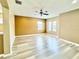 Upstairs bonus room features wood look floors, neutral paint, and lots of natural light at 4110 Huntingdale Ct, Wesley Chapel, FL 33543