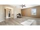 Upstairs bonus room features wood look floors, neutral paint and lots of natural light at 4110 Huntingdale Ct, Wesley Chapel, FL 33543
