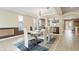 Dining room with an open-concept design, tiled floors, and modern accents, ready for entertaining at 4110 Huntingdale Ct, Wesley Chapel, FL 33543
