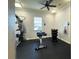 Well-equipped gym with weight machines, dumbbells, and various exercise equipment for a convenient workout at 4110 Huntingdale Ct, Wesley Chapel, FL 33543