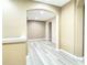 Upstairs hallway with light, wood look floors, neutral paint and recessed lighting at 4110 Huntingdale Ct, Wesley Chapel, FL 33543