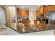 Kitchen showcasing granite countertops, stainless appliances, and a tiled backsplash at 4110 Huntingdale Ct, Wesley Chapel, FL 33543