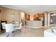Open floor plan from dining area into kitchen and staircase at 4110 Huntingdale Ct, Wesley Chapel, FL 33543