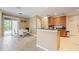 Kitchen adjoining dining area, featuring granite countertops and stainless appliances at 4110 Huntingdale Ct, Wesley Chapel, FL 33543