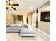 Inviting living room with an open floor plan and tiled floors, perfect for relaxation and entertaining at 4110 Huntingdale Ct, Wesley Chapel, FL 33543