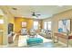 Living room with a ceiling fan, recessed lighting, and neutral decor at 4110 Huntingdale Ct, Wesley Chapel, FL 33543