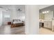 Main bedroom with wood look floors, trey ceilings, and neutral decor at 4110 Huntingdale Ct, Wesley Chapel, FL 33543