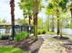 Community pool with palm trees offers a refreshing escape, perfect for relaxing and enjoying the outdoors at 4110 Huntingdale Ct, Wesley Chapel, FL 33543