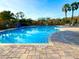 Sparkling swimming pool with clear blue water and a spacious deck for lounging at 4110 Huntingdale Ct, Wesley Chapel, FL 33543