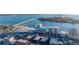 Stunning aerial shot highlighting beachfront condos next to a bridge with vibrant coastal real estate and ocean views at 800 S Gulfview Blvd # 403, Clearwater Beach, FL 33767