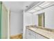 Bathroom with granite countertop and tiled floors at 800 S Gulfview Blvd # 403, Clearwater Beach, FL 33767
