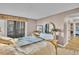 Comfortable bedroom with large bed, dresser, and balcony access at 800 S Gulfview Blvd # 403, Clearwater Beach, FL 33767