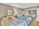 Inviting bedroom featuring two beds, soft lighting, and a mirrored closet, creating a cozy and restful atmosphere at 800 S Gulfview Blvd # 403, Clearwater Beach, FL 33767