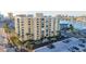 Exterior of the building with palm trees in the front of building and parking spaces available at 800 S Gulfview Blvd # 403, Clearwater Beach, FL 33767