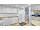 Bright kitchen with white cabinets, granite countertops, and stainless steel appliances at 800 S Gulfview Blvd # 403, Clearwater Beach, FL 33767