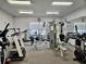 Spacious gym equipped with various exercise machines and weights for a complete workout at 8326 Fantasia Park Way, Riverview, FL 33578