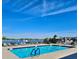 Outdoor pool overlooking a beautiful lake, with lounge chairs for relaxation at 8326 Fantasia Park Way, Riverview, FL 33578