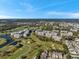 Expansive aerial view showcasing golf course and condo community with lakes at 960 Starkey Rd # 10301, Largo, FL 33771