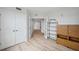 Bedroom featuring a double-door closet, neutral walls, and wood-look flooring at 960 Starkey Rd # 10301, Largo, FL 33771