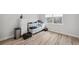 Bedroom featuring an external view, neutral walls, and wood-look flooring at 960 Starkey Rd # 10301, Largo, FL 33771