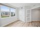Bright bedroom with hardwood floors, double closet and large window at 960 Starkey Rd # 10301, Largo, FL 33771
