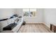 Bright bedroom with hardwood floors, window, closet and neutral paint at 960 Starkey Rd # 10301, Largo, FL 33771