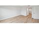 Clean bedroom featuring wood floors, white trim, and neutral color palette at 960 Starkey Rd # 10301, Largo, FL 33771