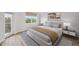 Serene bedroom with a plush bed, neutral tones, and a window that bathes the room in natural light at 960 Starkey Rd # 10301, Largo, FL 33771