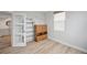 Bedroom interior featuring wood floors and a storage cabinet at 960 Starkey Rd # 10301, Largo, FL 33771