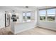 Modern kitchen with island, stainless appliances, and views overlooking a manicured golf course at 960 Starkey Rd # 10301, Largo, FL 33771