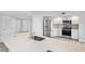 Modern kitchen featuring stainless steel appliances and a large island with quartz countertops at 960 Starkey Rd # 10301, Largo, FL 33771