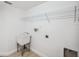 Bright laundry room with utility sink and shelving for storage at 960 Starkey Rd # 10301, Largo, FL 33771