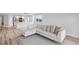 Bright and modern living room features hardwood floors, neutral paint and comfortable couch at 960 Starkey Rd # 10301, Largo, FL 33771