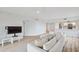 Spacious living room features hardwood floors, neutral paint and comfortable couch at 960 Starkey Rd # 10301, Largo, FL 33771