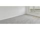 Bright bedroom with neutral carpet and white walls, illuminated by natural light from multiple windows at 1165 Kistna Dr, Zephyrhills, FL 33540