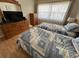 Cozy bedroom with twin beds, dresser, and large window with sheer curtains at 1235 S Highland Ave # 3-303, Clearwater, FL 33756