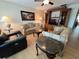 Inviting living room showcasing a comfortable seating arrangement and an elegant entertainment center at 1235 S Highland Ave # 3-303, Clearwater, FL 33756