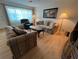 Bright living room with lots of seating and a large window at 1235 S Highland Ave # 3-303, Clearwater, FL 33756