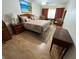 Comfortable main bedroom with wooden furniture and a cozy rug at 1235 S Highland Ave # 3-303, Clearwater, FL 33756