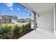 Inviting front porch view showcasing the neighborhood with well-maintained lawns and craftsman style homes at 1267 Kazaz Ct, Zephyrhills, FL 33540