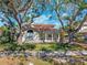 Lovely home exterior featuring a classic facade, well-maintained landscaping, and mature trees at 1370 Brightwaters Ne Blvd, St Petersburg, FL 33704