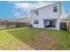 Wide backyard with healthy green lawn, privacy fence, and partial shade at 25925 Terrawood Loop, Land O Lakes, FL 34639